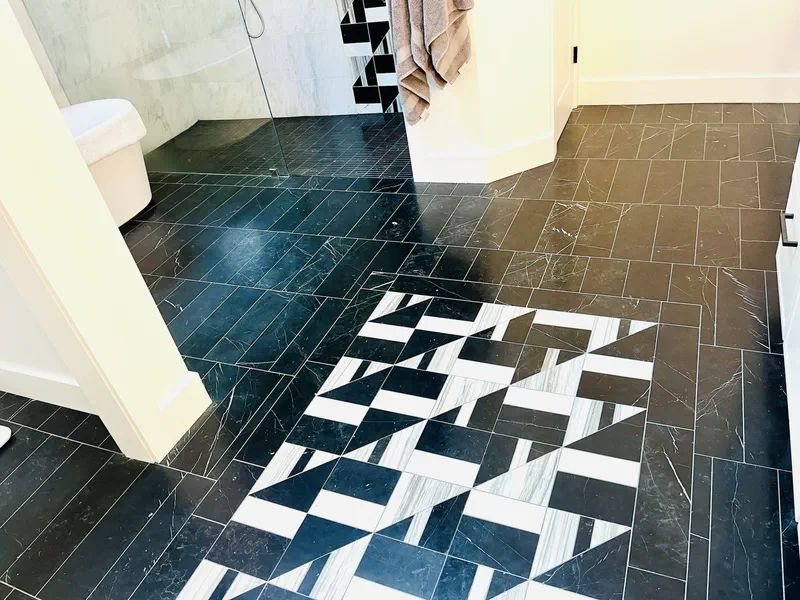 Black marble floor with a hand-laid geometric pattern