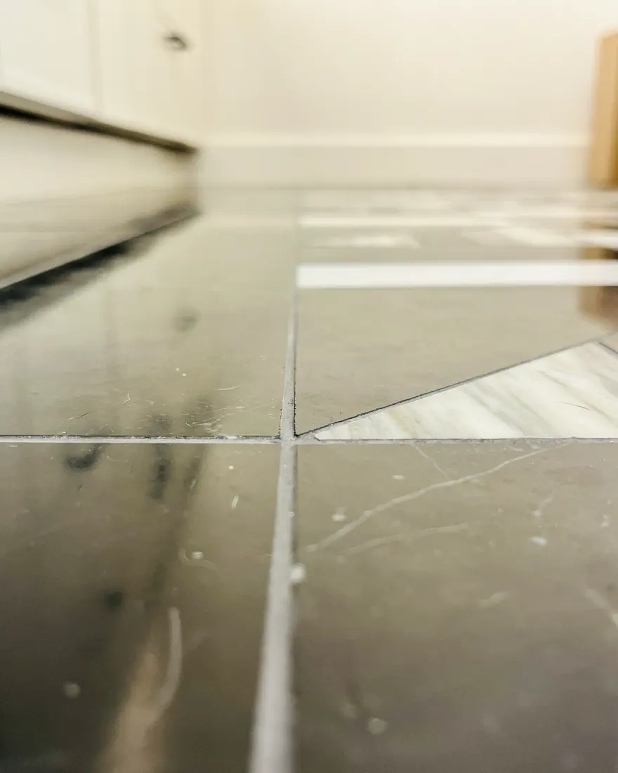 Low-angle view of tight, level tile joints