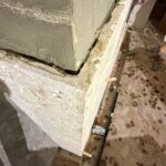 Natural stone column wrap with mitered corner in progress by Floors of Glory